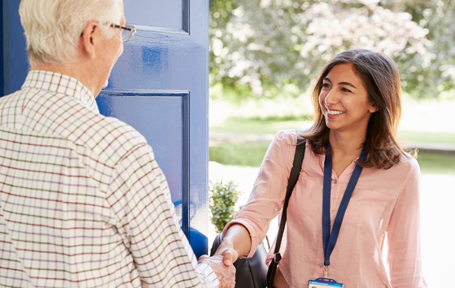 An MSCP student shakes hands with a client