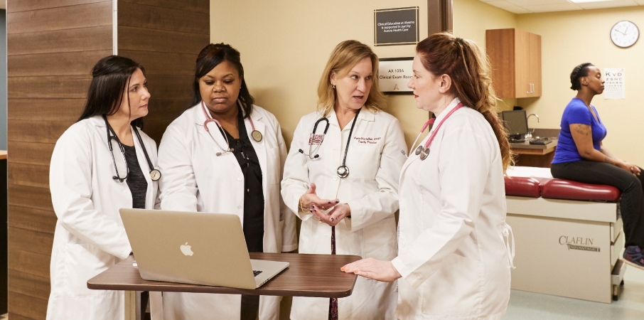 Group of MSN students discuss patient outcomes