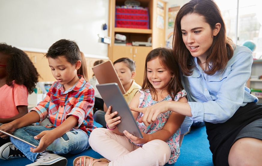 An education major student teaching with elementary students